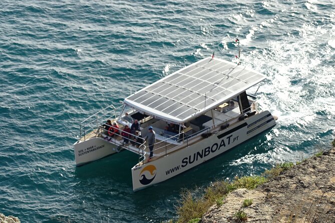 Benagil Caves & Coast from Portimão on an Eco-Friendly Catamaran - Onboard comfort: shade, toilet, music, and snack options