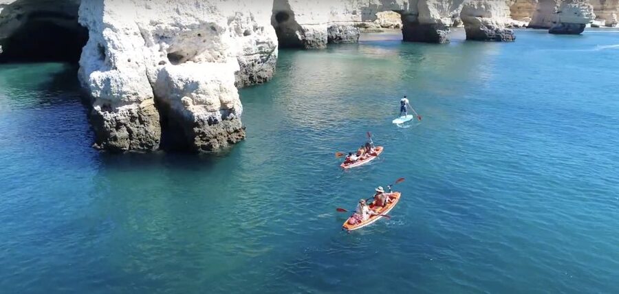 Benagil: Caves, Coves & Secret Beaches Guided Kayaking Tour - The coast paddle: Benagil Beach to Praia da Marinha, teal water and cave-hugging views