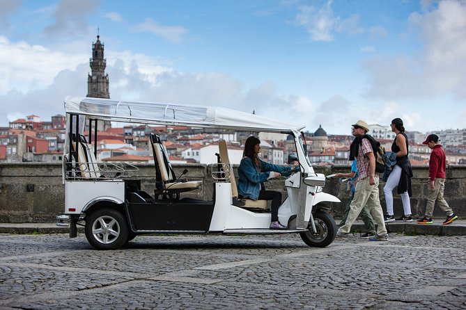 Discover Porto's Highlights on a 2-Hour Private Electric Tuk Tuk - Aliados Avenue and Cordoaria: Porto’s civic boulevard and a green pause