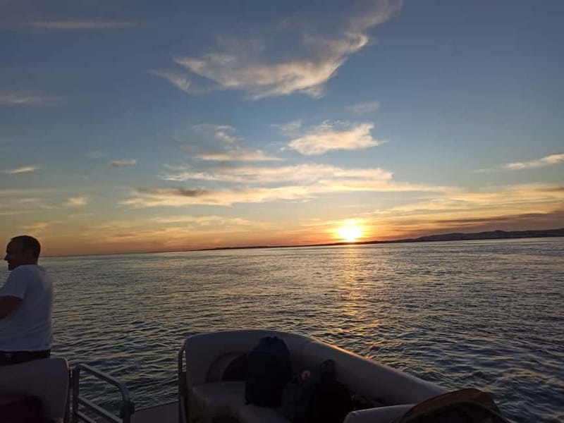 Faro: Sunset 1 hour Ria Formosa Boat Tour - Cruising the Ria Formosa channels on a catamaran