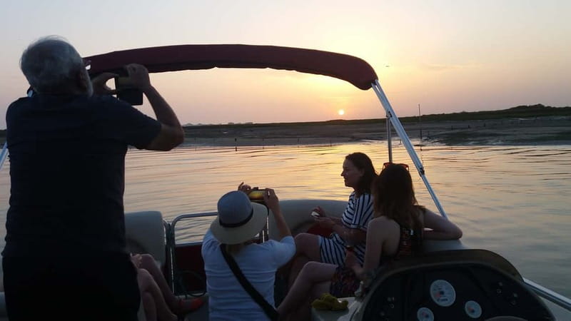 Faro: Sunset 1 hour Ria Formosa Boat Tour - The sunset moment: how the colors land on the water