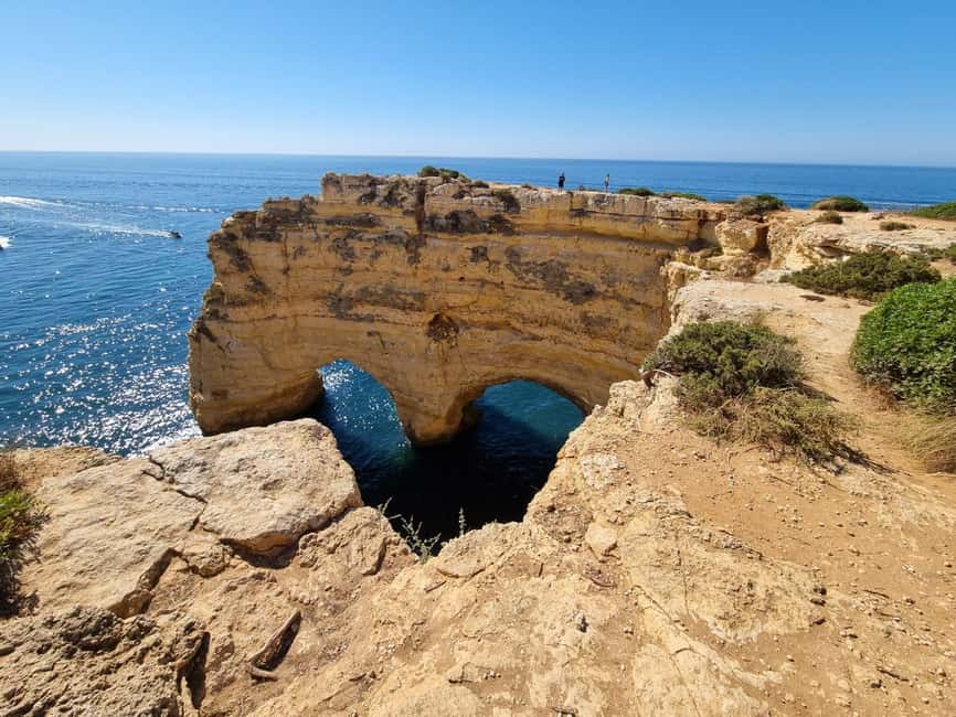 From Faro: Benagil Cliffs Hiking & 4 Treasures Experience - Praia da Marinha: the bridge, heart, and Titanic view