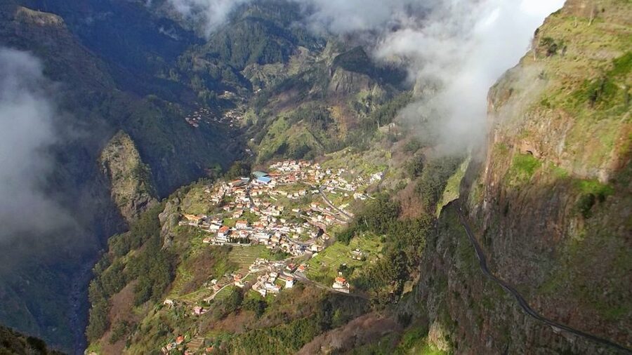 From Funchal: Nuns Valley, Monte and Sleigh Ride Tour - Curral das Freiras: lava rocks, pirate fears, and liquor tasting that’s actually included