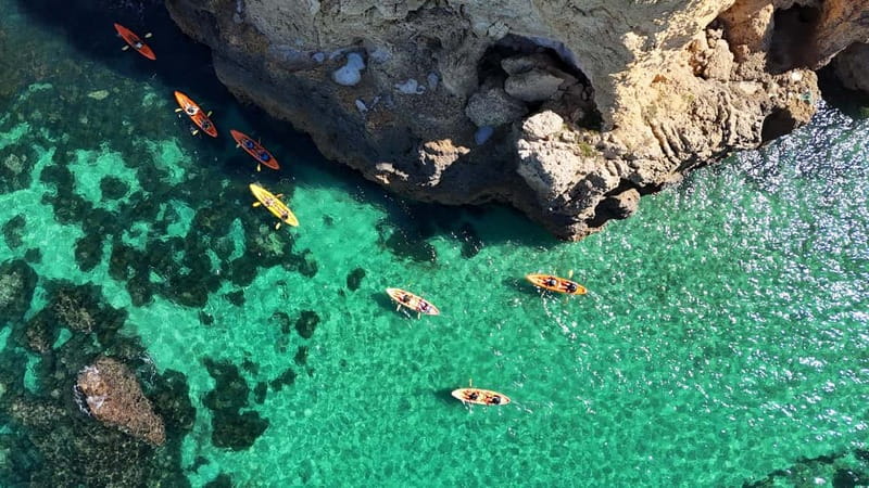 From Lagos: Ponta da Piedade Caves Kayak Tour from Catamaran - Guided kayaking for about 1.15 hours through grottoes and arches