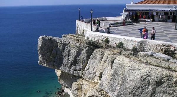 From Lisbon: Fátima, Batalha, Nazaré and Óbidos Day Tour - The guide, van size, and how the day stays on track
