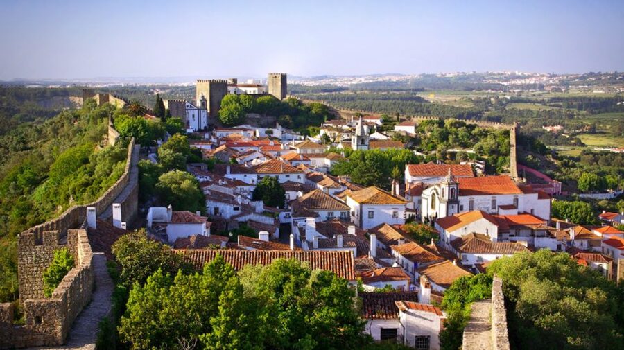 From Lisbon: Fátima, Batalha, Nazaré & Óbidos Full-Day Tour - Nazaré: fishing village views, the 1182 cliff legend, and big wave culture