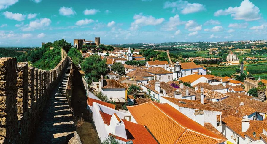 From Lisbon: Nazare Big Waves & Óbidos Small Group Tour - Two very different stops, one smooth 8-hour day