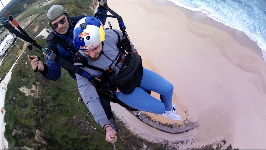 From Lisbon: Paragliding Tandem Flight - What You See From Above: Ocean Color, Cliffs, and a Calm Glide