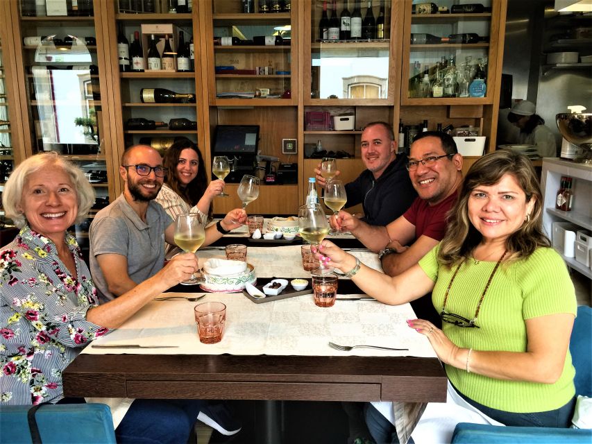 From Porto: Braga & Guimarães with Lunch Small Group Tour - Lunch in Braga: a relaxed meal with Vinho Verde on the table