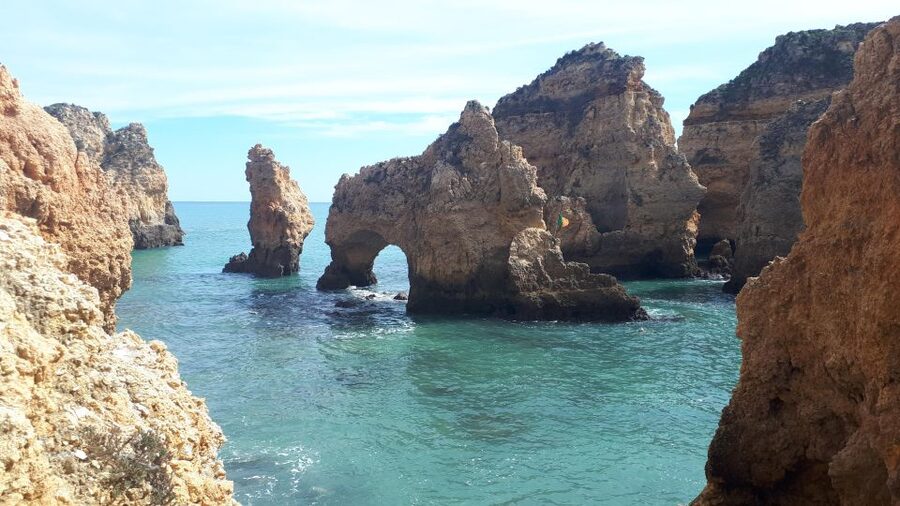 Lagos Grotto Trip in Different Languages - Two Captains, One Story: What the Guide Adds