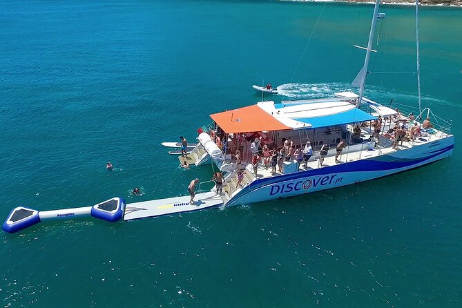 Lagos Half-Day Catamaran Cruise with Lunch - On Board: Live Commentary, Paddles, and the Waterpark Toys