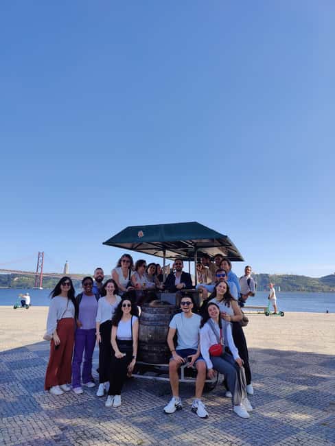 Lisbon: 1-Hour Beer Bike Tour with Draft Beer & Sangria Ride - Weather reality: rain or shine means you ride, so dress for it