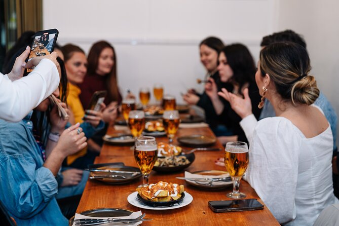 Lisbon: Award-Winning Guided Walking Food Tour with Local Drinks - Stop 3, Rua da Vitória: sardines, seafood rice, and crisp vinho verde
