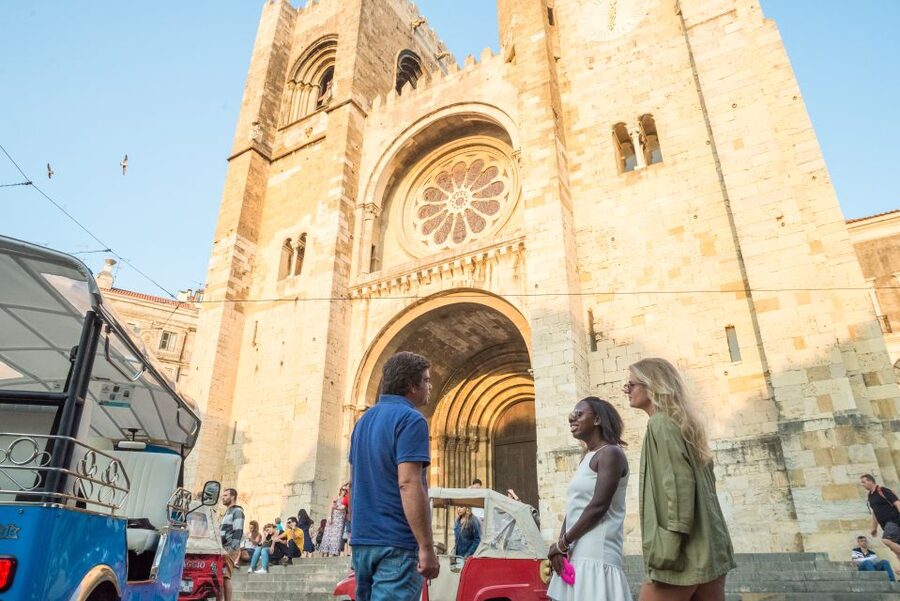 Lisbon by Tuk Tuk Guided Tour: City of Neighborhoods - Feira da Ladra flea market energy and the stories around it