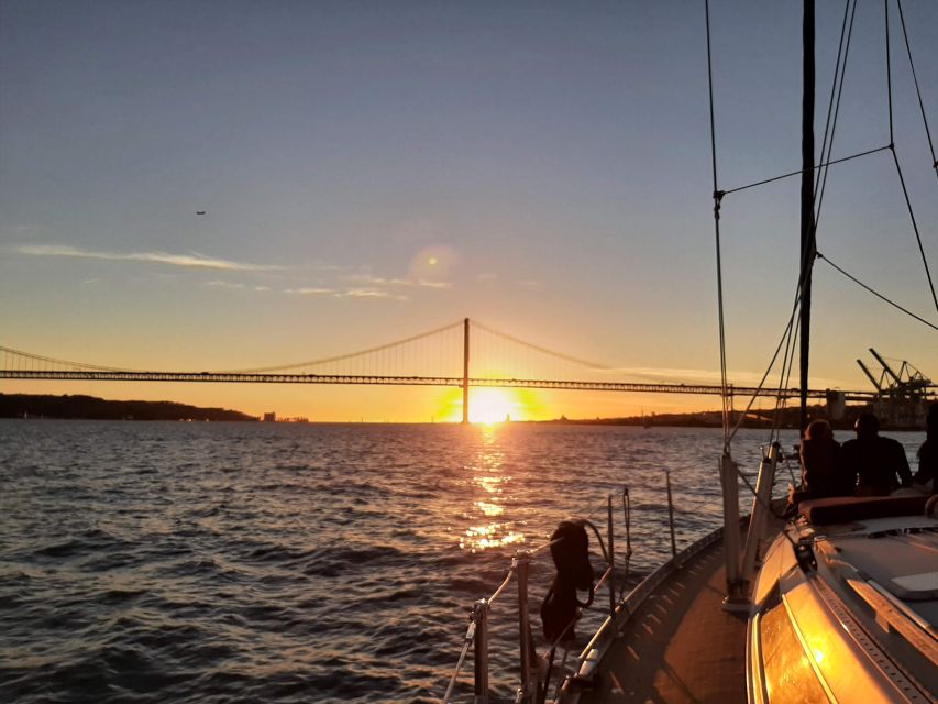 Lisbon: City Skyline Sailboat Cruise with Drink and Snacks - Leaving Lisbon by Water, Under 25 de Abril and Toward Praça do Comércio