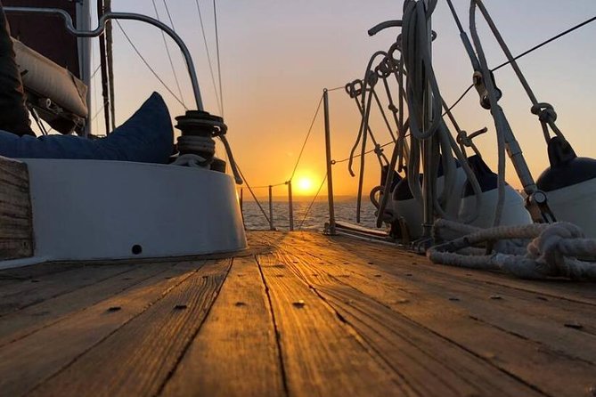 Lisbon: Daylight or Sunset on a Vintage Sailboat - Tagus River sunset pacing: wine, petiscos, and the perfect time to breathe