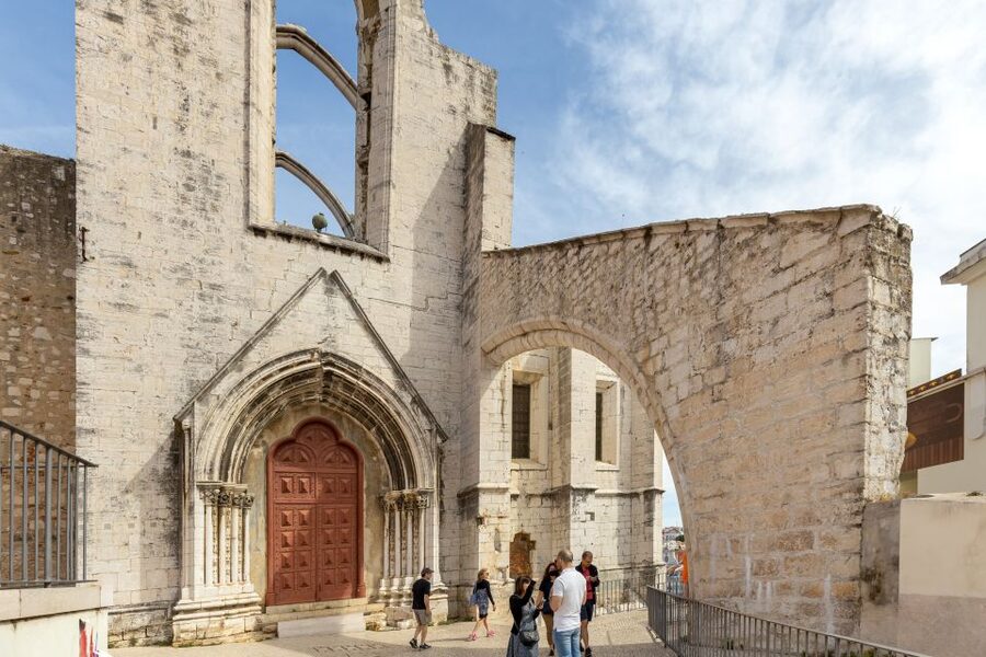 Lisbon: History, Stories and Lifestyle Walking Tour - Riding the iconic tram from the castle area to Portas do Sol