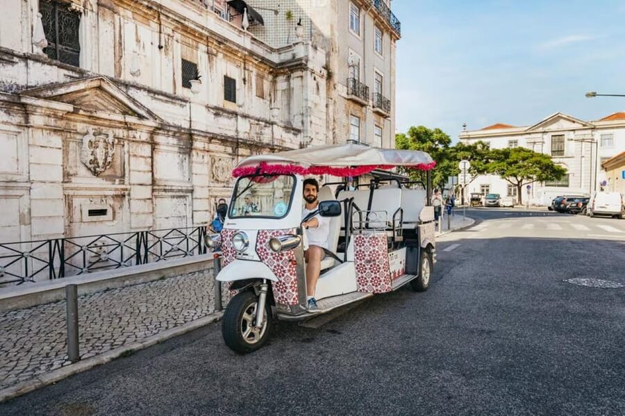 Lisbon: Private Guided Tuk-Tuk Tour with Hotel Pickup - Rossio Square and Santa Justa Lift areas for a classic Lisbon pulse