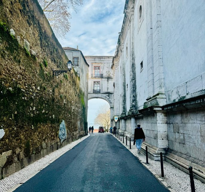 Lisbon: Private Sightseeing Tour by Tuk-Tuk - Graça Historic District pass-by: a neighborhood bridge, not a dead end