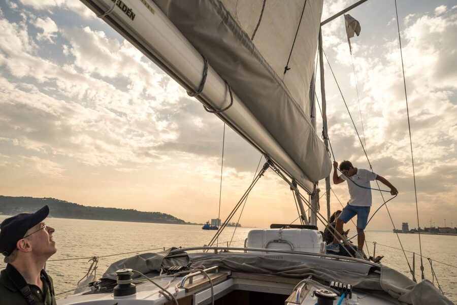 Lisbon: Private Sunset Cruise on the Tagus River with Drink - Vasco da Gama Bridge in the distance, a modern bookend