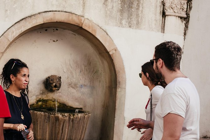Lisbon Small-Group Food Tour with 18 Tastings in Alfama District - Stop 1 in Alfama: Food, Land and Sea, and Local Rhythm