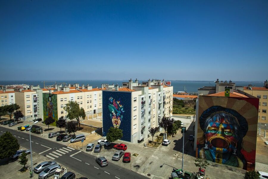 Lisbon: Street Art Tuk Tuk Tour - Art deco industrial warehouses, worker neighborhoods, and city vegetable gardens