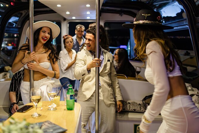 Lisbon: Sunset DJ & Porto Tonic Premium Boat Experience - Drink and snack game: open bar plus Portuguese tasting