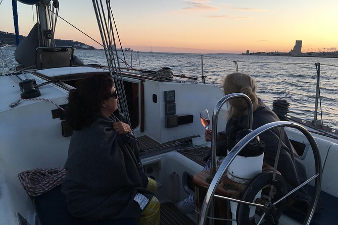 Lisbon Sunset Sailing Tour with White or Rosé Wine and Snacks - A royal palace and a museum garden overlooking the Tagus