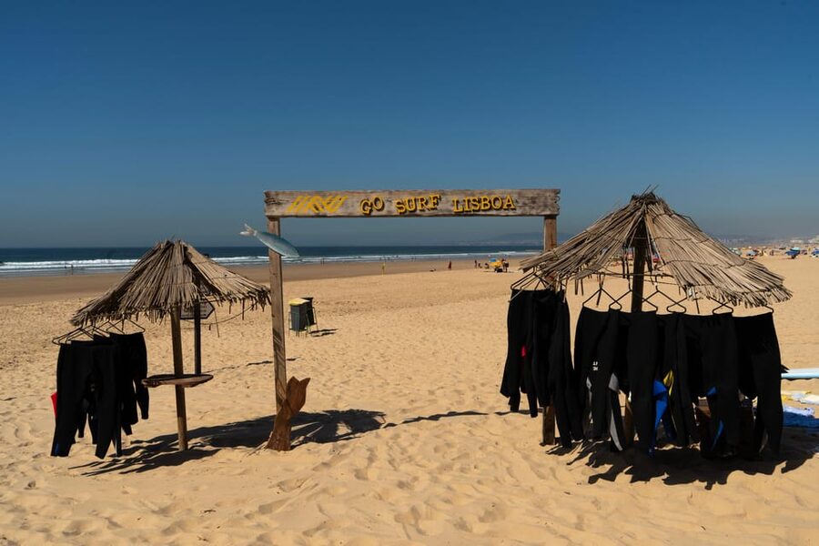 Lisbon: The Surf Instructor - surf lessons with transfer - The photographer in the water: fun memory, extra cost