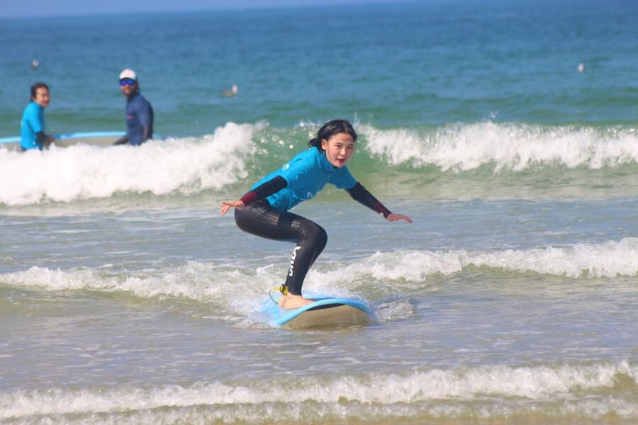 Matosinhos: Surfing Lesson with Equipment - Sand warmups: standing up and paddling the right way