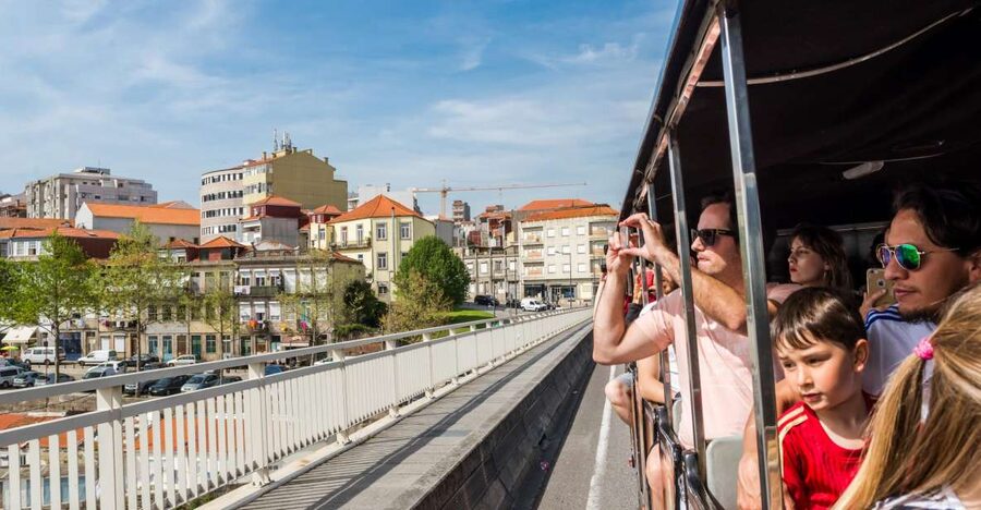 Porto: City Train Tour, River Cruise & Wine Cellar - Magic Train city loop: audio on loudspeakers and a fast way to orient yourself