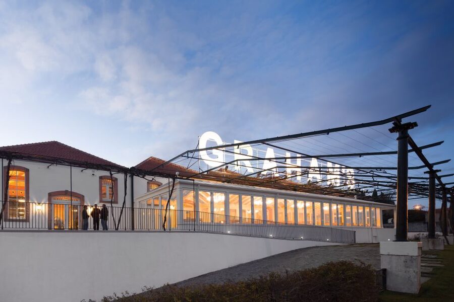 Porto: Graham's Port Lodge Tour & Vintage Room Wine Tasting - The guided walk: terraces, the lodge building, and the real cellar setting