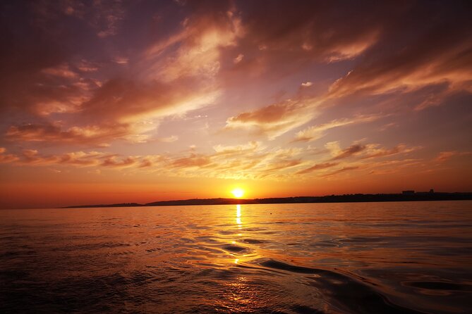 Sunset on a Luxury Sailing Yacht from Vilamoura (Max 12 Guests) - Stop 2: A smaller sea-only cove with clay on one side and rock on the other